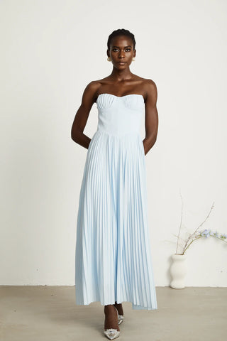 Strapless blue pleated maxi dress with shell-shaped chest cup and corset-style bodice, an elegant House of CB dupe inspired by the Marcella dress. Perfect for formal events, weddings, or as an alternative bridal gown.