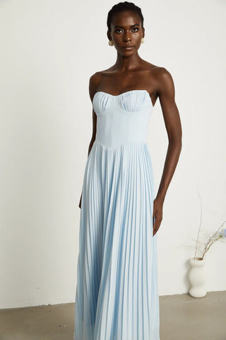 Strapless blue pleated maxi dress with shell-shaped chest cup and corset-style bodice, an elegant House of CB dupe inspired by the Marcella dress. Perfect for formal events, weddings, or as an alternative bridal gown.