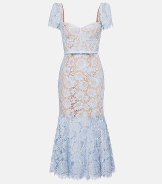 Model wearing baby blue lace midi dress with corset bodice and short lace sleeves