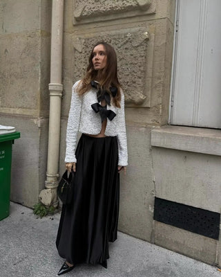 White sequin party top with black bow details