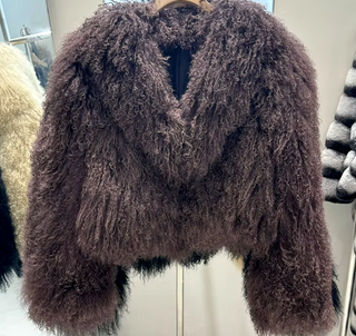 Luxurious coffee brown Mongolian fur jacket coat with a fluffy big collar, showcasing its elegant cropped design and real sheep fur craftsmanship. Fur Jacket Burgundy Real - Cielie