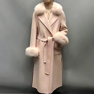 Elegant maxi cashmere wool coat in light pink with real fox fur collar and cuffs, featuring side pockets and a belted waist for a tailored fit.