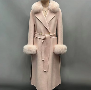 Elegant maxi cashmere wool coat in light pink with real fox fur collar and cuffs, featuring side pockets and a belted waist for a tailored fit.
