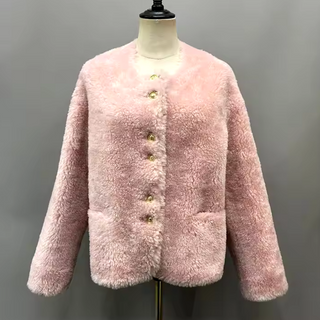 Cropped plush wool fur jacket in soft pink with gold buttons, single-breasted design, cozy teddy coat style for winter. Teddy coat