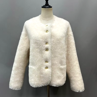 Cropped plush wool fur jacket in soft pink with gold buttons, single-breasted design, cozy teddy coat style for winter. Teddy coat white