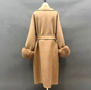 Elegant long camel cashmere wool coat with detachable fox fur cuffs, perfect for winter sophistication.