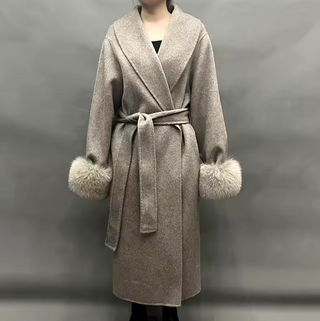 Elegant long camel cashmere wool coat with detachable fox fur cuffs, perfect for winter sophistication. Beige