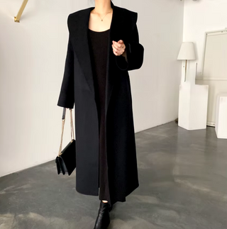 Elegant black cashmere wool coat with a belted waist and large lapel, showcasing its sophisticated double-sided design. Cielie Max Mara Coat