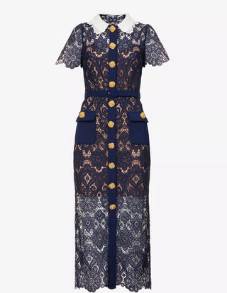 Model wearing navy guipure lace midi dress with white contrast collar and gold buttons Austrian Fashion Brand