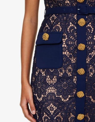 Model wearing navy guipure lace midi dress with white contrast collar and gold buttons Austrian Fashion Brand