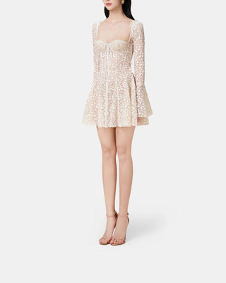 Model wearing the 'Romance' Lace Dress in beige, featuring long sleeves, an A-line silhouette, a bustier top, and intricate lace detailing, perfect for weddings and special occasions. Mini Elegant Designer - Cielie