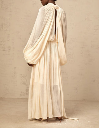 Ivory modest wedding dress with dolman sleeves and floor-length pleated satin skirt – perfect for formal bridal occasions.