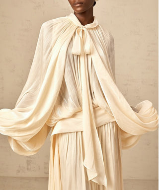 Back of ivory bridal maxi dress featuring rear button fastening and elegant drape – modest long sleeve wedding dress.