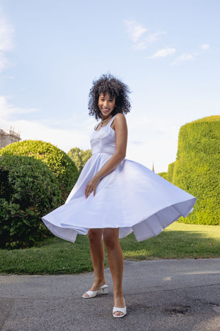 Elegant Alaia bridal dress with a vintage modern chic design, featuring a flattering V-neckline, sleeveless cut, adjustable back straps, and a full skirt with a subtle flare. Perfect minimalistic wedding gown for the contemporary bride seeking timeless elegance.Modern clean minimal dress white A line Spaghetti Straps, Corset Bustier - Cielie