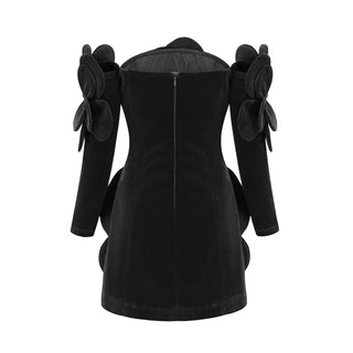 Model wearing a black velvet off-the-shoulder dress with large floral appliqué detailing and matching gloves, perfect for holiday parties, Christmas, and New Year's celebrations.