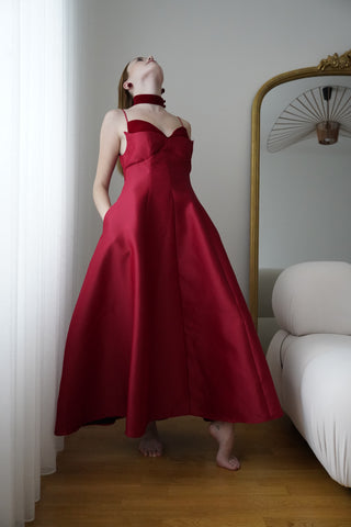 Stunning wine red cocktail dress with velvet choker and flare midi skirt. Ideal for formal events, parties, and available for ball gown rental in Vienna.