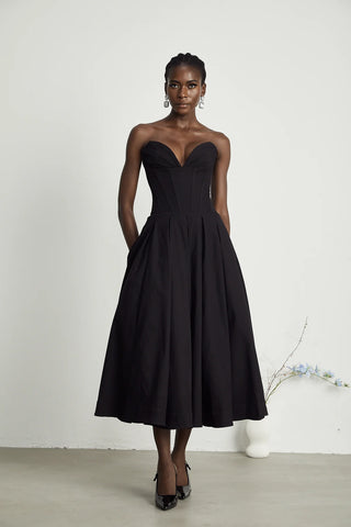 Elegant black strapless corset midi dress with pleated skirt, V-neckline, and off-the-shoulder design. A chic dupe for House of CB dresses, perfect for formal events and cocktail parties. Cielie Vienna Lady