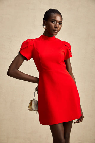 Front view of a red Christmas mini dress with puff sleeves, high neckline, and a chic A-line fit.