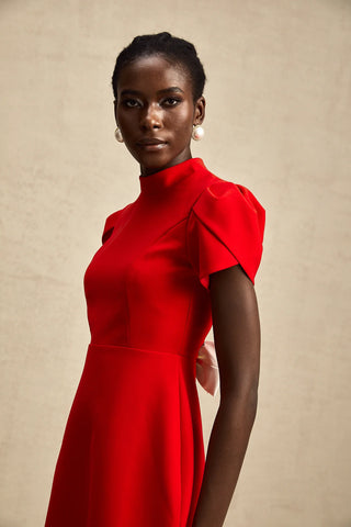 Front view of a red Christmas mini dress with puff sleeves, high neckline, and a chic A-line fit.