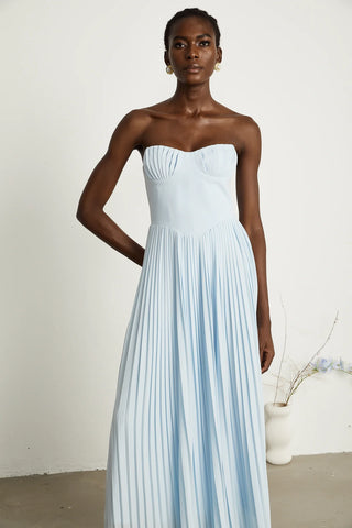 Strapless blue pleated maxi dress with shell-shaped chest cup and corset-style bodice, an elegant House of CB dupe inspired by the Marcella dress. Perfect for formal events, weddings, or as an alternative bridal gown.