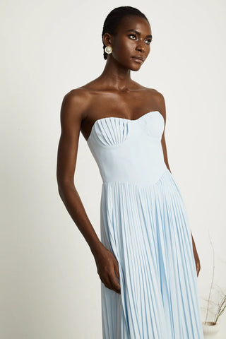 Strapless blue pleated maxi dress with shell-shaped chest cup and corset-style bodice, an elegant House of CB dupe inspired by the Marcella dress. Perfect for formal events, weddings, or as an alternative bridal gown.