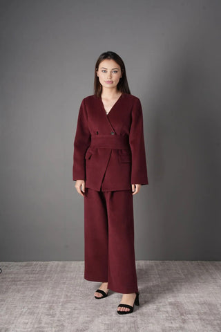 Front view of the Voera Wool Suit 2-Piece Blazer Pants Set in Burgundy, featuring a tailored blazer with belt and wide-leg trousers.