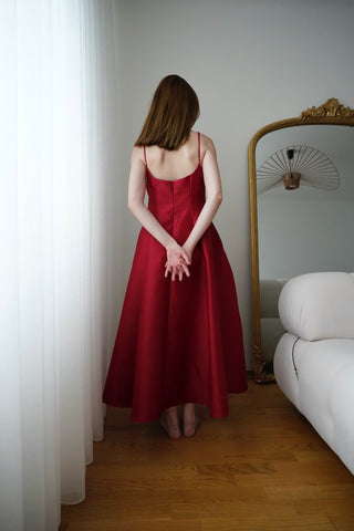 Stunning wine red cocktail dress with velvet choker and flare midi skirt. Ideal for formal events, parties, and available for ball gown rental in Vienna.