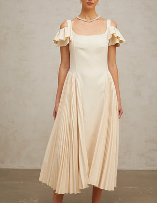Woman wearing a neutral pleated midi dress with flutter sleeves and darted bodice, ideal for elegant summer events, wedding guest looks, or garden parties.