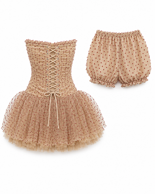 A two-piece toddler girl's outfit set featuring a strapless tulle tutu dress with a lace-up corset bodice and matching polka-dot bloomers, in a light tan/beige color.