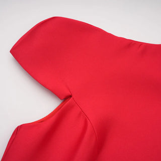 Red garment with a hood on a light gray background