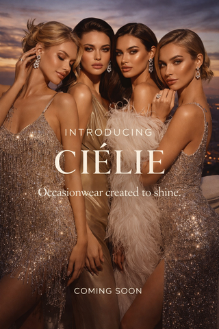 Four women in glamorous outfits with 'Cielie' text against a sunset sky.