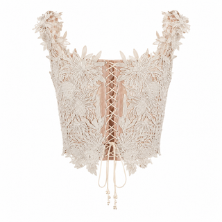 An intricate beige lace and crochet corset top with floral embroidery, wide shoulder straps, and a lace-up front closure, displayed on a clean white background.