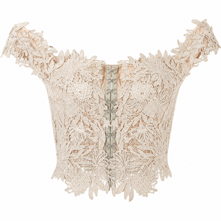 An intricate cream lace corset top with off-the-shoulder straps, a structured floral lace pattern, and a central lace-up closure, shown against a plain white background.