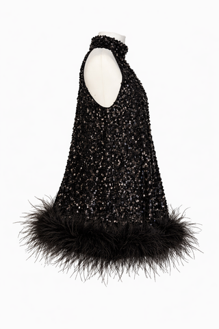 Black sequined dress with feather trim on a white background