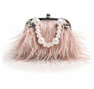 Feminine handbag with pink feathers and pearl embellishments on a white background