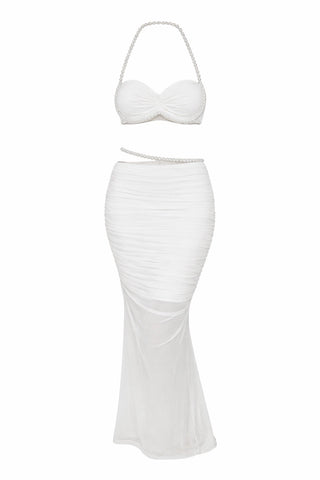 White two-piece outfit with a strapless top and fitted skirt on a white background