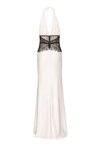 White evening gown with black lace detailing on a white background