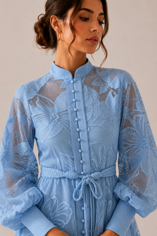 Powder blue floral lace mini dress featuring intricate embroidered lace, sheer long sleeves, high neckline, detachable braided waist belt, coordinating slip dress, fit and flare silhouette, and concealed back zipper closure, perfect for wedding guests, baby showers, bridal showers, garden parties, and elegant spring or summer occasions.