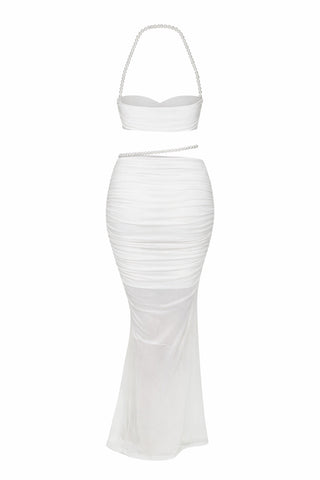 White two-piece outfit with a strapless top and fitted skirt on a white background
