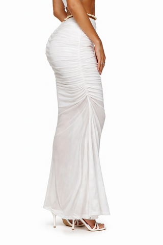 Woman wearing a white evening gown on a white background