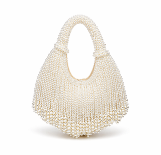 Pearl-handled handbag on a white background