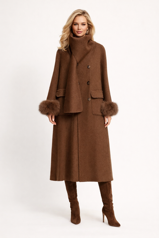 Woman wearing a brown coat with fur trim on a white background