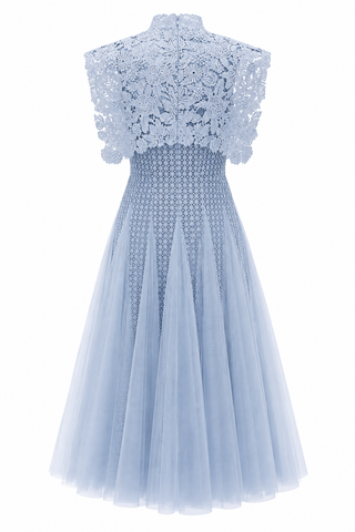 A light blue sleeveless dress with a floral lace high-neck bodice, a smocked patterned waist, and a voluminous tulle skirt, shown against a plain white background.