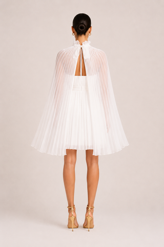 Elysia white bridal mini dress with detachable pleated cape, strapless wedding dress featuring a structured silhouette and hidden back zipper for modern brides, receptions and courthouse weddings. Mini Dress Cape White Tulle