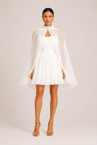 Elysia white bridal mini dress with detachable pleated cape, strapless wedding dress featuring a structured silhouette and hidden back zipper for modern brides, receptions and courthouse weddings. Mini Dress Cape White Tulle