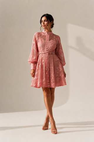 Pink floral lace mini dress featuring intricate embroidered lace, sheer long sleeves, high neckline, detachable braided waist belt, coordinating slip dress, fit and flare silhouette, and concealed back zipper closure, perfect for baby showers, wedding guests, bridal showers, garden parties, spring events, and summer occasions. Pink Summer Babyshower Dress Mini