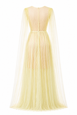 A pale yellow tulle gown shown from the back, featuring a sheer lace bodice, long draped cape sleeves, and a full flowing skirt on a white background.