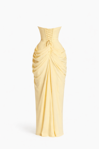 Yellow strapless gown with ruched design on a white background