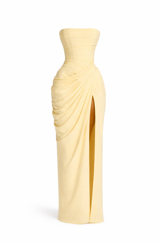 Yellow strapless dress with a draped design on a white background