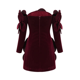 Model wearing a wine-red velvet off-the-shoulder dress with large floral appliqué detailing and matching gloves, creating an elegant and sophisticated look for special occasions. Cielie Vienna Fashion 